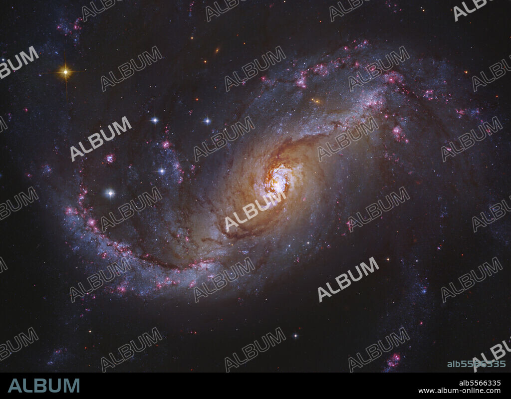 NGC 1672 is a prototypical barred spiral galaxy in the constellation Dorado, and differs from normal spiral galaxies in that the spiral arms do not twist all the way into the centre. Instead, they are attached to the two ends of a straight bar of stars enclosing the nucleus.