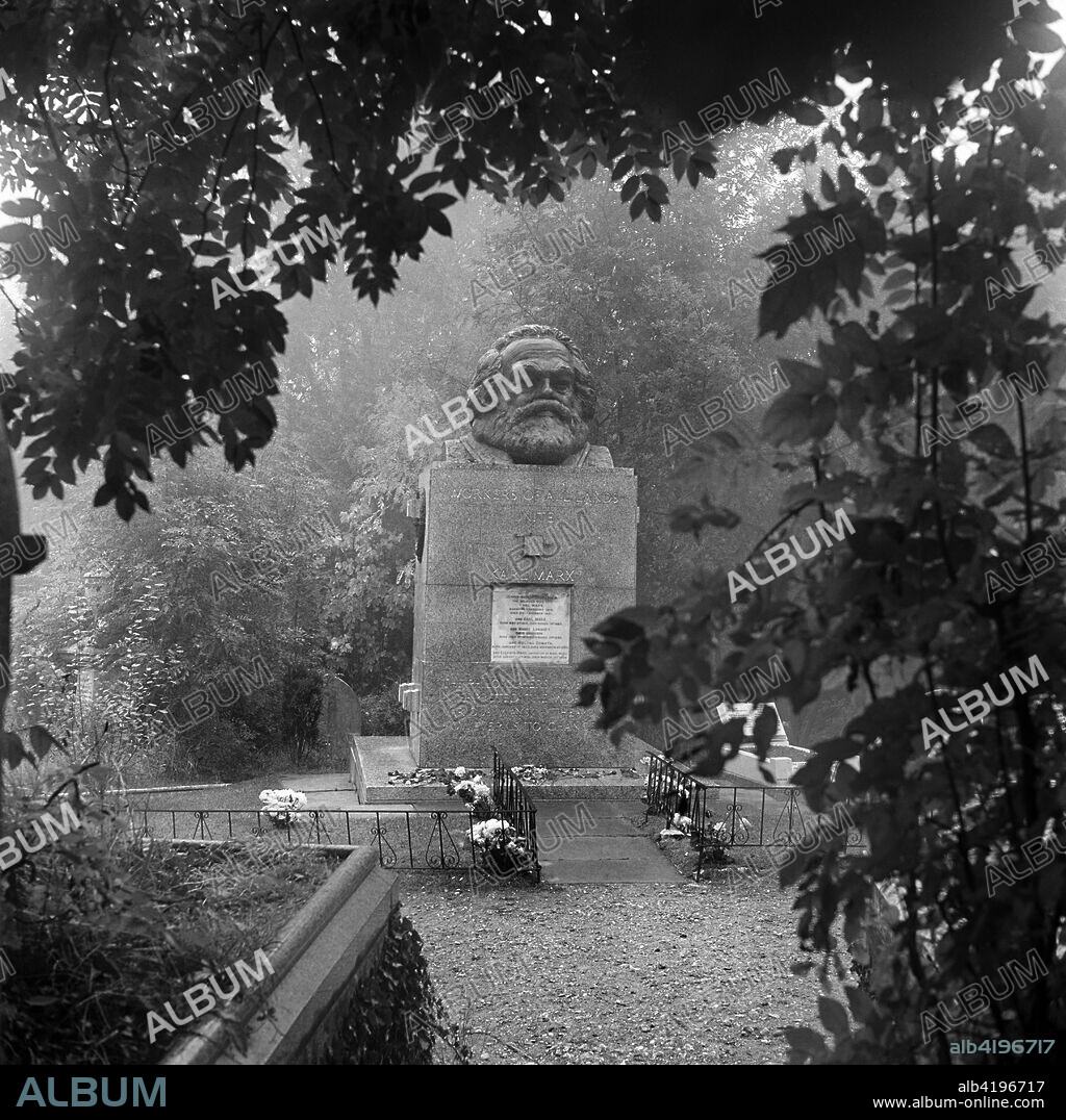 Tomb of Karl Marx, Highgate Cemetery, Hampstead, London, 1954. A view towards the tomb of the German political philospher who died in London in 1883. He was originally buried elsewhere in the East Cemetery, but his remains were moved to the current grave in 1954.