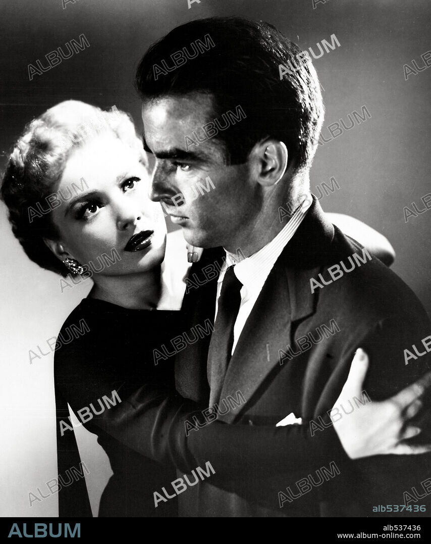 ANNE BAXTER and MONTGOMERY CLIFT in I CONFESS, 1953, directed by ALFRED HITCHCOCK. Copyright WARNER BROTHERS.