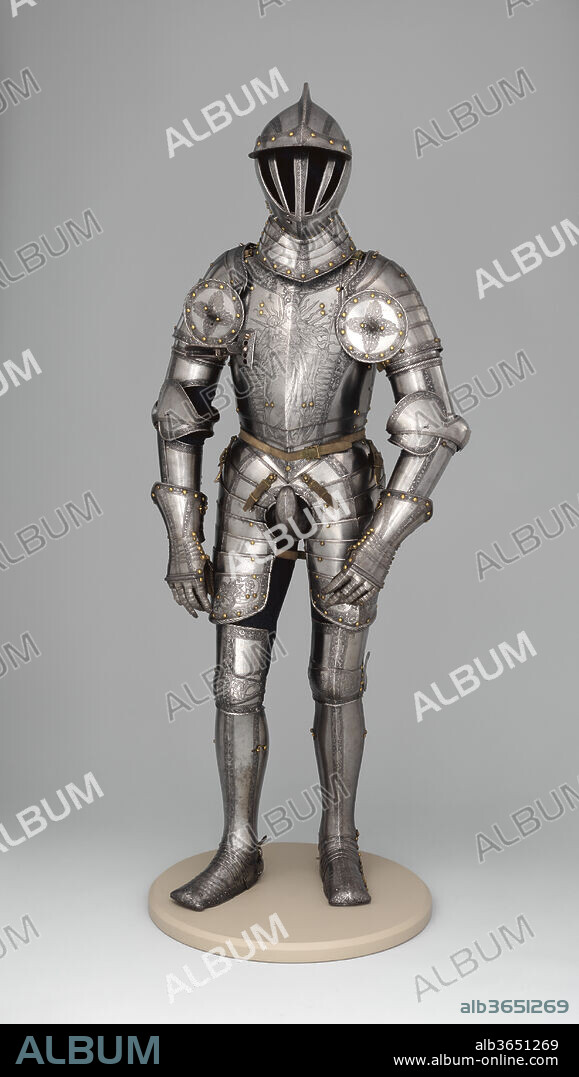 Armor of Emperor Ferdinand I (1503-1564). Armorer: Kunz Lochner (German, Nuremberg, 1510-1567). Culture: German, Nuremberg. Dimensions: H. 67 in. (170.2 cm); Wt. 52 lb. 14 oz. (24 kg). Date: dated 1549.
The ownership of this armor by Ferdinand I (1503-1564) is indicated by the heraldic emblems on the toe caps: the imperial double-headed eagle surmounted by a royal crown, which signifies Ferdinand's honorific status as king of the Romans and designated successor to his brother, Emperor Charles V. The image of the Virgin and Child on the breastplate was also used by Charles V on his own armors. The backplate is decorated with crossed staves and firesteels, the insignia of the Order of the Golden Fleece, an elite chivalric society of which Ferdinand was a member.
Kunz Lochner, Nuremberg's most celebrated armorer of the period, made several armors for both Ferdinand and his son Archduke Maximilian (1527-1576), including two matching armors produced about 1546 that are very similar to the one exhibited here.
The helmet of the Museum's armor was not made for it originally but has been associated with the armor since at least the early nineteenth century.