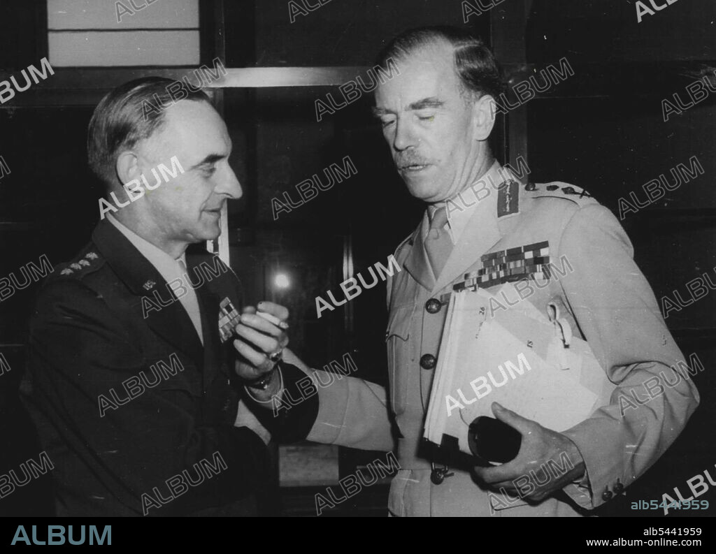 Allied Military Governors Confer -- General Sir Brian Robertson, British Commander-in-Chief, Germany (right) conferring with General Clay, United States Military Governor (left) at the Frankfurt IG Farben Building, following a conference with the German Ministers with whom agreement was reached on the London communique concerning the establishment of a Western German Federalised Government. July 28, 1948.