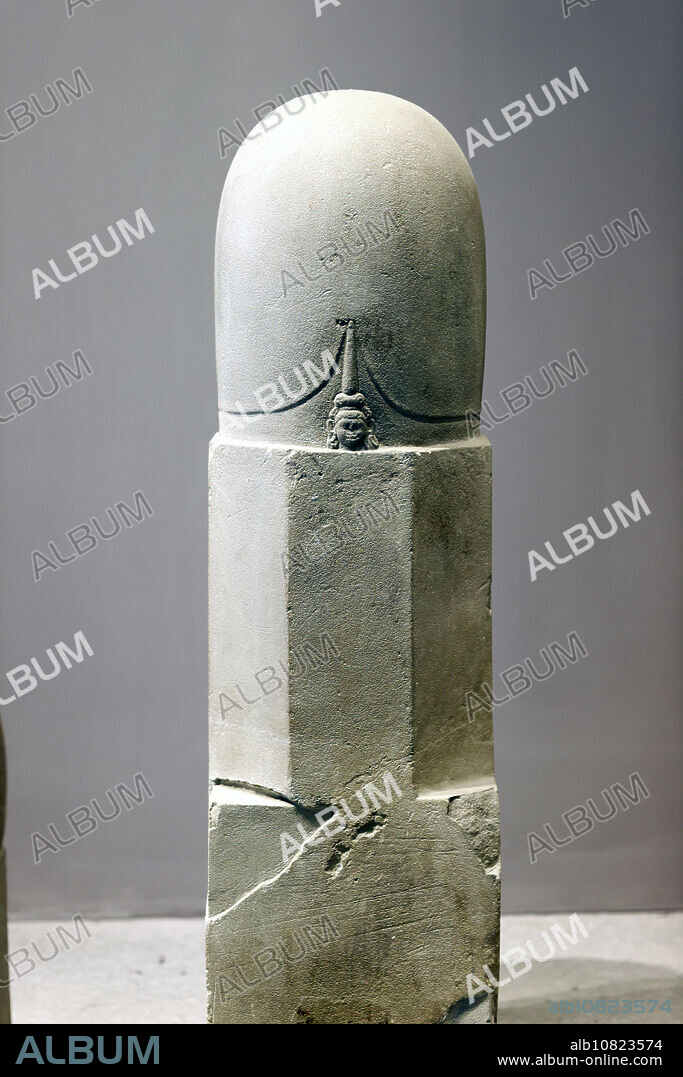 Museum of Vietnamese History. Mukhalinga or Mukhalingam is a linga with one human faces. The linga is an aniconic representation of the Hindu god Shiva. 7 th century. Sandstone. Ho Chi Minh city. Vietnam.