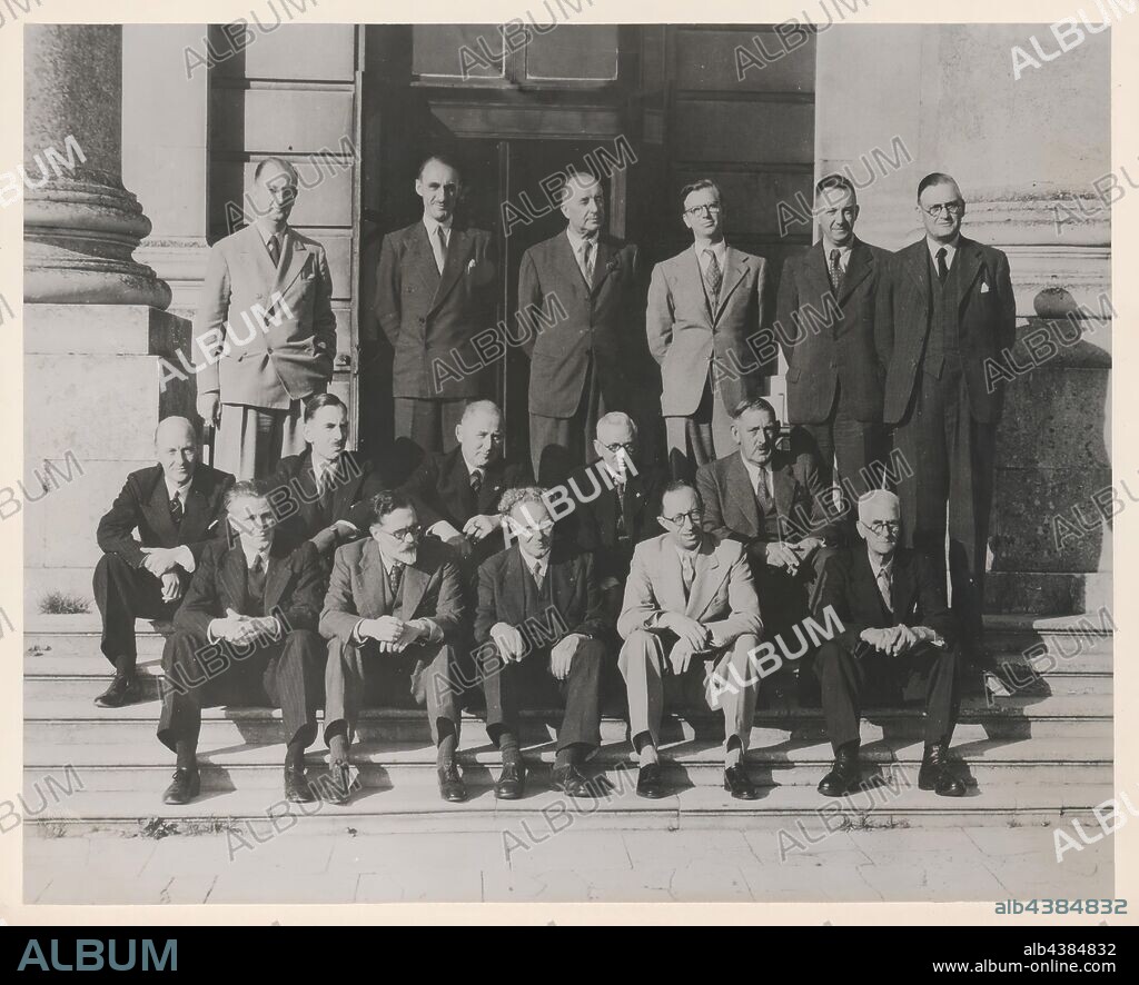 Photograph - Male Staff at Kodak Limited, Harrow, England, circa 1950s, Black and white photograph of sixteen male staff from Kodak Limited, Harrow, England, taken circa 1950s. The men are seated and standing in front of a Kodak factory building, presumably at the Harrow factory in England. This photograph is related to a number of other photographs and a manuscript written by Margaret D Gauntlett, titled 'A History of Kodak Limited', issued by Kodak Limited.