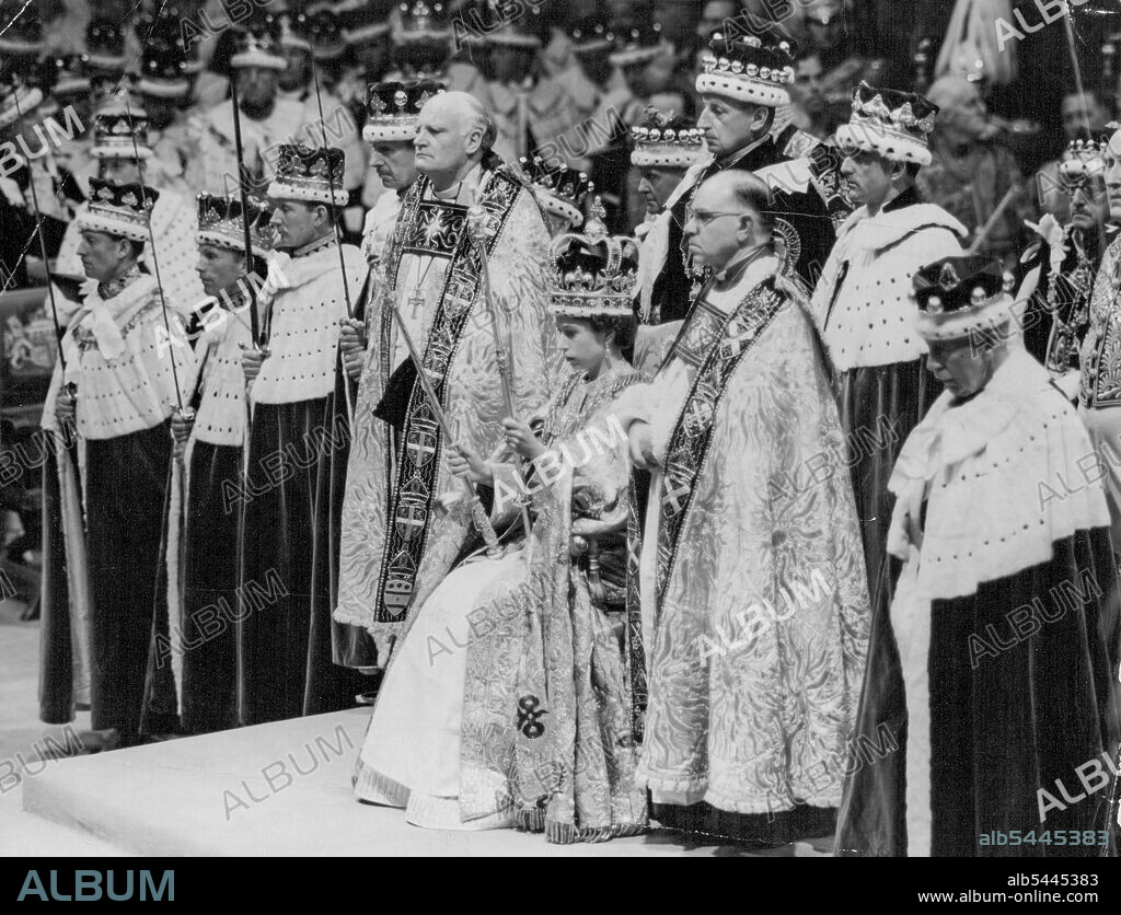 Queen - Of Justice And Mercy -- The Queen, seated upon the Throne and wearing St. Edward's Crown, holds the Royal Sceptre, ensign of kingly power and justice, and the Rod with the Dove, Rod of equity and mercy, as she prepares to receive homage after the crowing in Westminster Abbey, London, to-day. Coronets of peers and peeresses make a splendid background to the scene. June 02, 1953. (Photo by Reuterphoto).