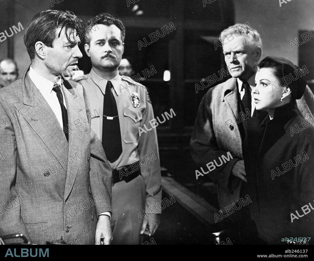CHARLES BICKFORD, JAMES MASON and JUDY GARLAND in A STAR IS BORN, 1954, directed by GEORGE CUKOR. Copyright WARNER BROTHERS.