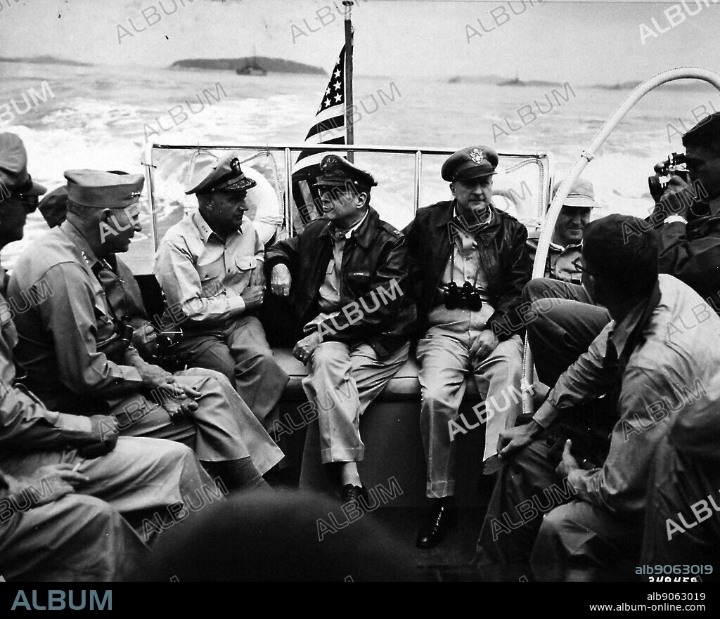 Korean War: Incheon Landing, September 1950. Lieutenant General Lemuel C. Shepard, USMC; Vice Admiral A.D. Struble, USN; General Douglas MacArthur, USA; and Brigadier General Courtney Whitney, USA, make pre-invasion inspection of landing areas at Inchon from Admiral's launch, September 15, 1950.