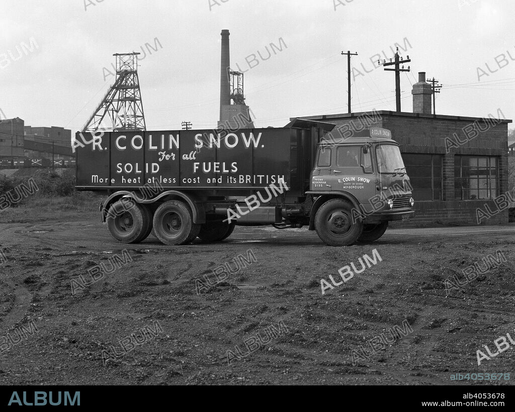 R Colin Snow coal merchants wagon, Barnburgh Colliery, South Yorkshire, 1961. Snow's were one of the many coal merchants operating in the South Yorkshire area, selling locally mined coal. This Bedford TK is parked on the weighbridge of Barnburgh Colliery. When the pit was closed in the 1980s, the site was cleared to make way for the ill fated Earth Centre, the lottery funded ecological centre which swallowed £115 million of funding only to close a year or so after its opening. Snow's still operate as a coal merchant although now with imported coal.