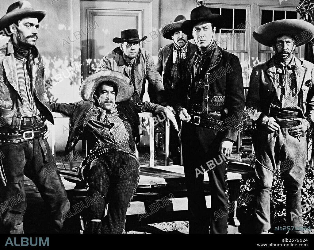 ANTHONY QUINN and ROBERT TAYLOR in RIDE, VAQUERO!, 1953, directed by JOHN FARROW. Copyright M.G.M.