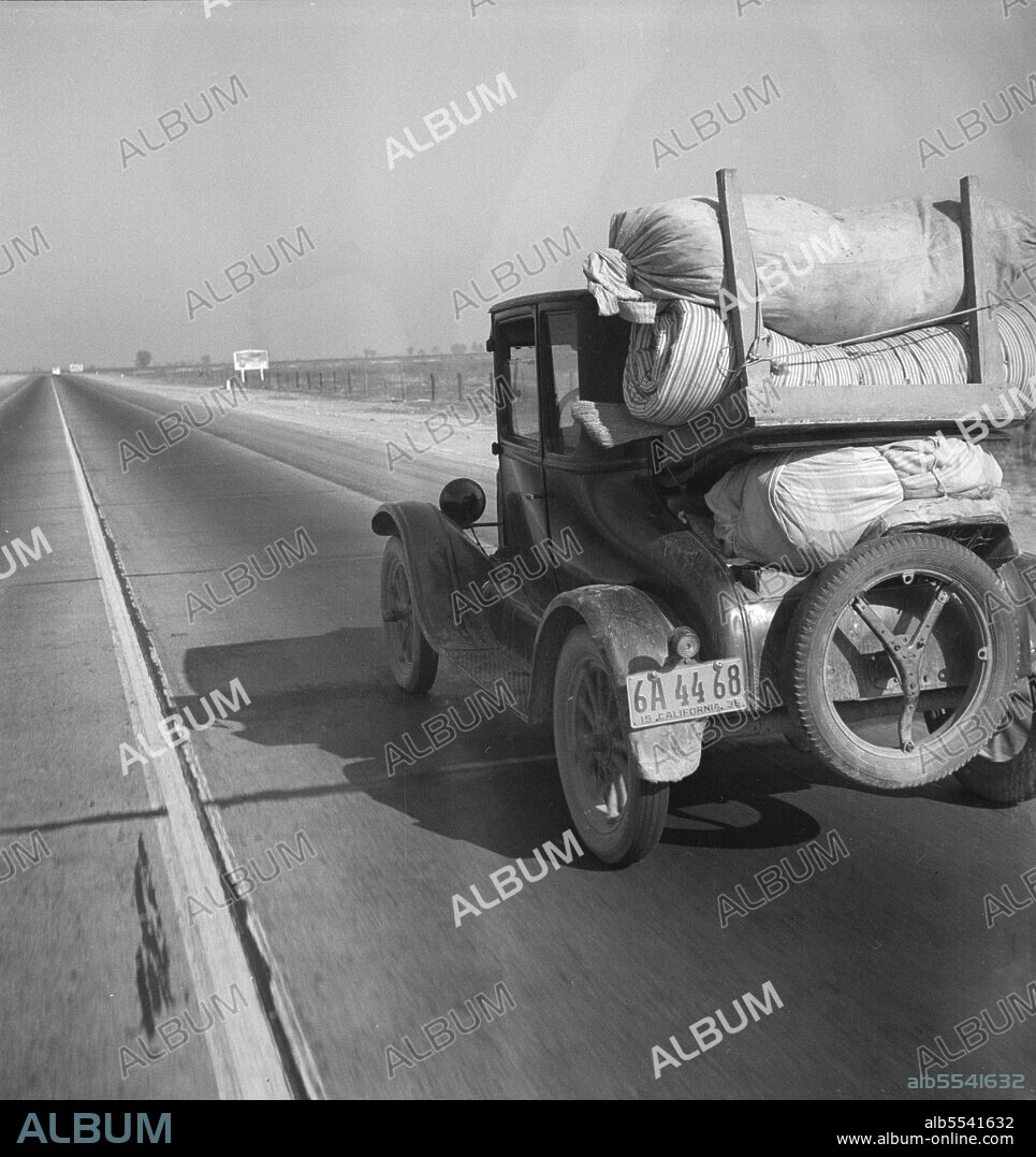 DOROTHEA LANGE. Drought refugee's car on U.S. Highway 99 between Bakersfield and Famoso, California. Note: the photographer passed twenty-eight cars of this type (drought refugees) between Bakersfield and Famoso, thirty-five miles, between 9:00 and 9:45 in the morning.