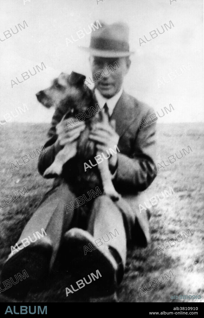Fred Griffith (1879-1941). British microbiologist and epidemiologist Frederick Griffith with his dog. Griffith specialized in the epidemiology and pathology of infectious disease. By 1927 he had developed what is known as Griffiths Experiment - one of the first experiments suggesting that bacteria are capable of transferring genetic information through a process known as transformation. And in 1928 reported the first widely accepted demonstrations of bacterial transformation, showing that bacteria can change their form and function.