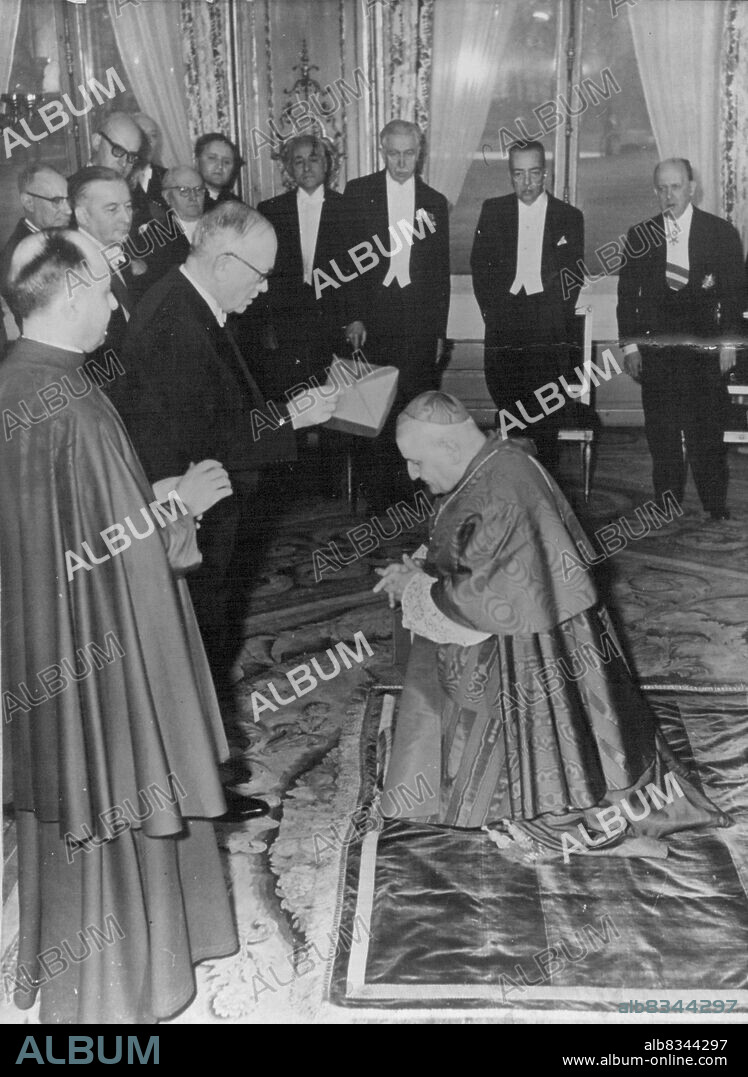 Cardinal's Biretta from hands of French PresidentPhoto shows:- M.Vincent Auriol placing the Biretta on Mgr.Roncalli's head in the background can be seen the ambassadors of Canada. Turkey and Italy. Front, Left, is the Pope's representative Mgr.Testa.On Thursday at a ceremony in the Salon Des Ambassadors in the Palais De L'Elysee. The French president presented, on the Pope behalf, a Cardinal's Biretta to Monsigneur Roncalli. Mgr.Roncalli is the Apostolic ***** in France. January 17, 1953. (Photo by Paul Popper).
