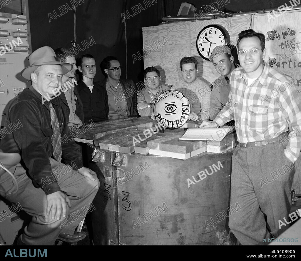Editorial use only . Cowan far left, and Reines, far right with Poltergeist team, 1955. The Cowan-Reines neutrino experiment was performed by Clyde Lorrain Cowan Jr (1919-1974) and Frederick Reines (1918-1998) American physicists in 1956. This experiment confirmed the existence of the antineutrino, a neutrally charged subatomic particle with very low mass. They performed the experiment preliminarily at Hanford Site, but later moved the experiment to the Savannah River Plant in South Carolina near Aiken where they had better shielding against cosmic rays. After months of data collection, they had accumulated data on about three neutrinos per hour in their detector. To be absolutely sure that they were seeing neutrino events from the detection scheme described above, they shut down the reactor to show that there was a difference in the number of detected events. Reines received the Nobel Prize in 1995 for his work on neutrino physics.