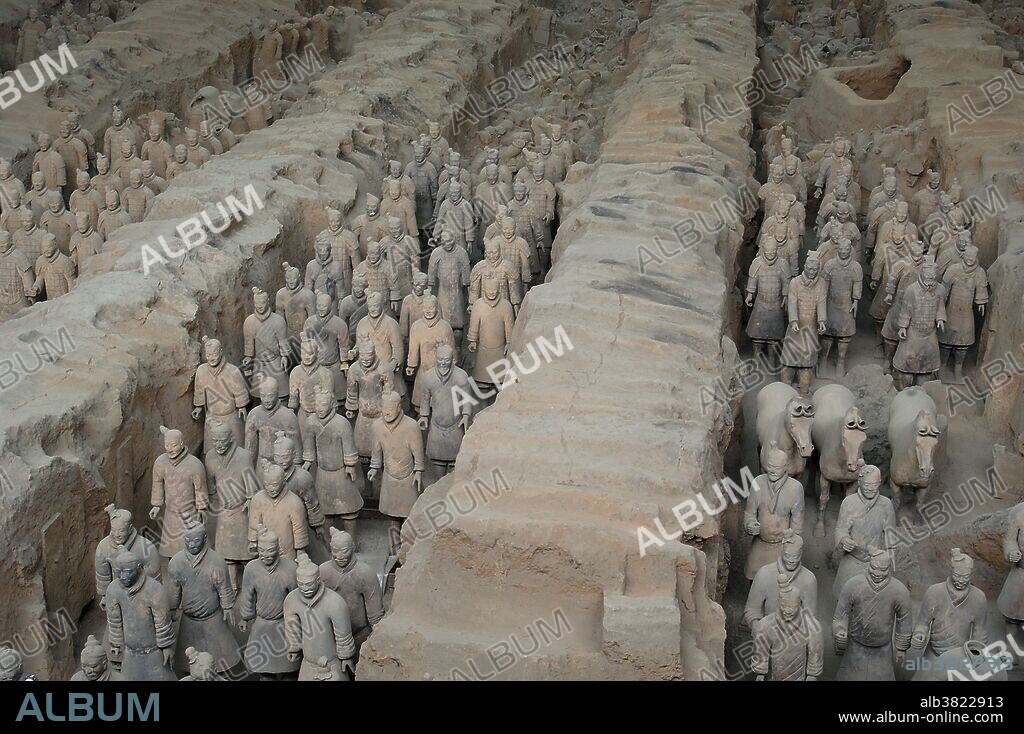 Excavated Tomb of terracotta warriors, Xi'an, China. A full army of terracotta warriors were created to guard the tomb of Quin Shi Huang, the first emperor of China, who died in 210 BC. It was discovered by farmers digging a well in 1974. This is a view of pit #1. It is now a World Heritage site.
