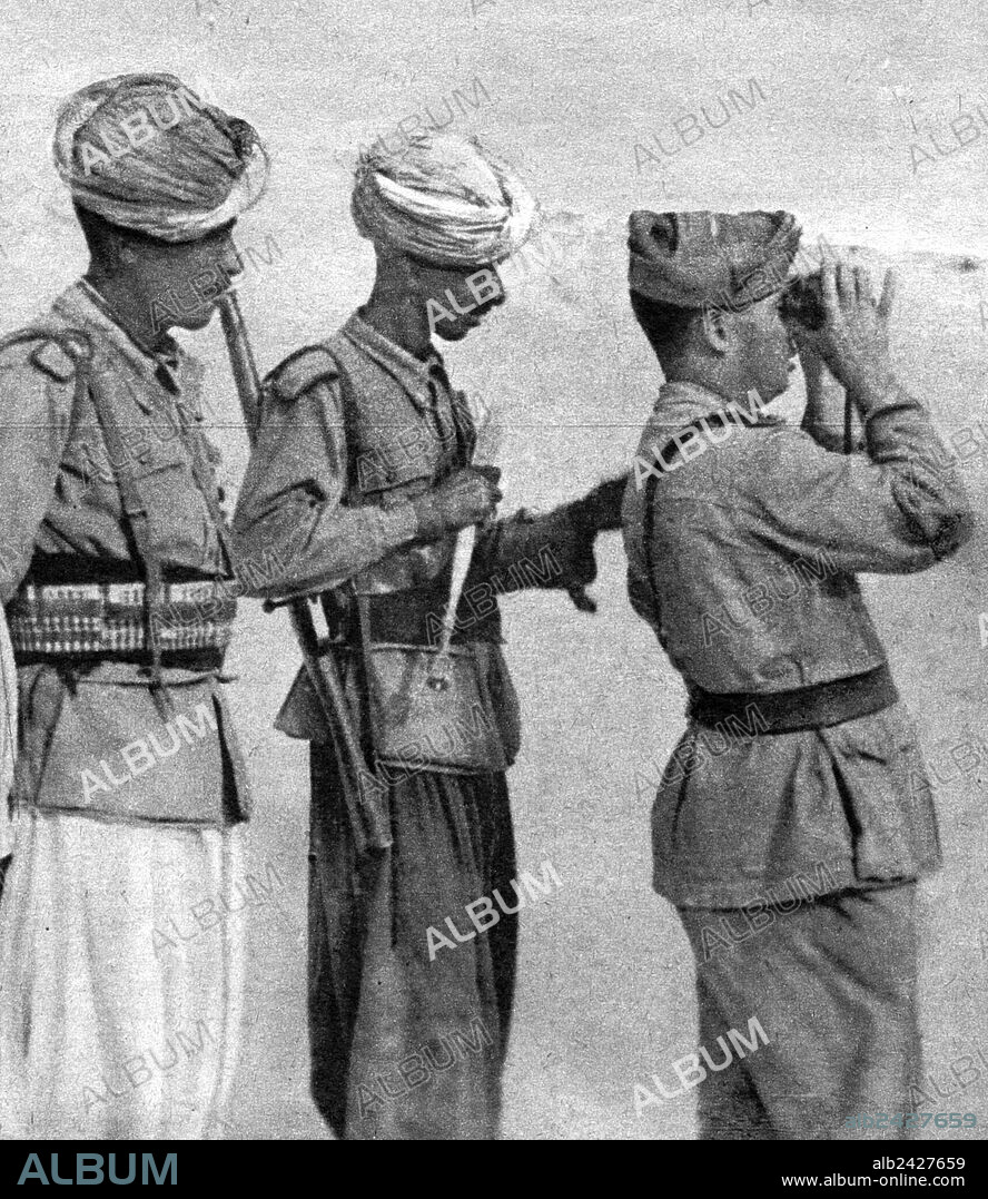 WWII-1940 1941 Second World War North African Campaign talian airport. An italian officer with some Ascari at Guarabub post.