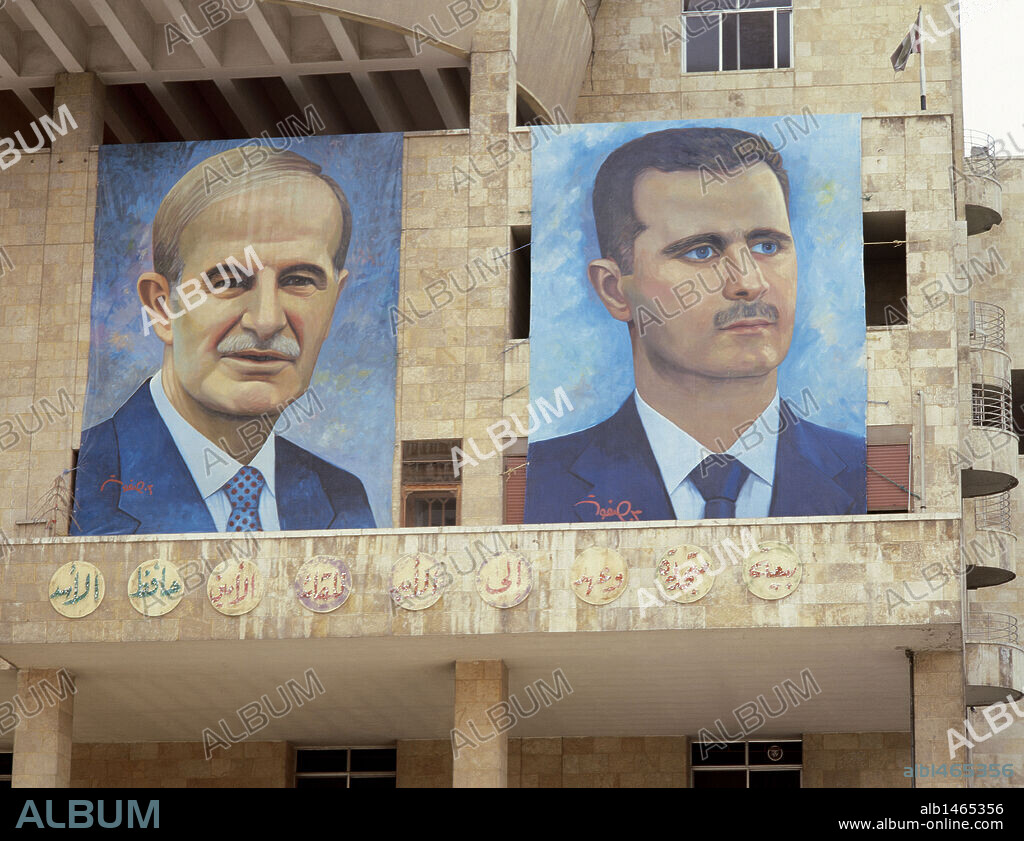 Presidents of Syria. Left: Hafez al-Asad (1930-2000), right: Basahr al-Assad (1965). Large portraits. Hamidie souk. Damascus. Picture took before the Civil War.