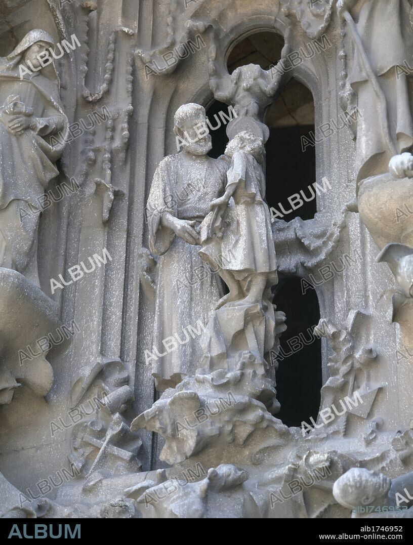 Spain. Catalonia. Barcelona. Basilica and Expiatory Church of the Holy Family. Designed by catalan architect Antonio Gaudi (1852-1926). Modernist style. The Nativity (facade to the East). Constructed between 1894-1930. St. Joseph and baby Jesus. Sculped by Llorenc Matamala i Pinol (1856-1925).