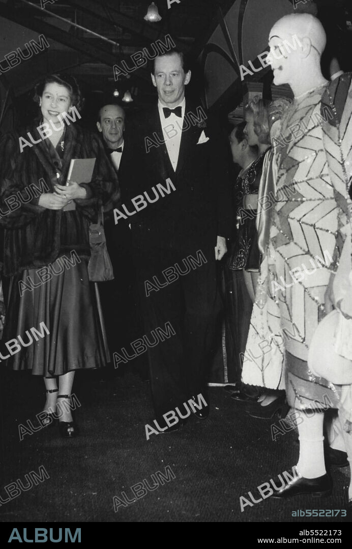 Princess Elizabeth Attends CircusAccompanied by Cyril Mills smiles as she passes Percy Huxter, the clown, when she arrived at Olympic, London, this evening, December 30, to attend Bertram Mills Circus. Behind them (centre background) is Bernard Mills. December 30, 1948. (Photo by Associated Press Photo).
