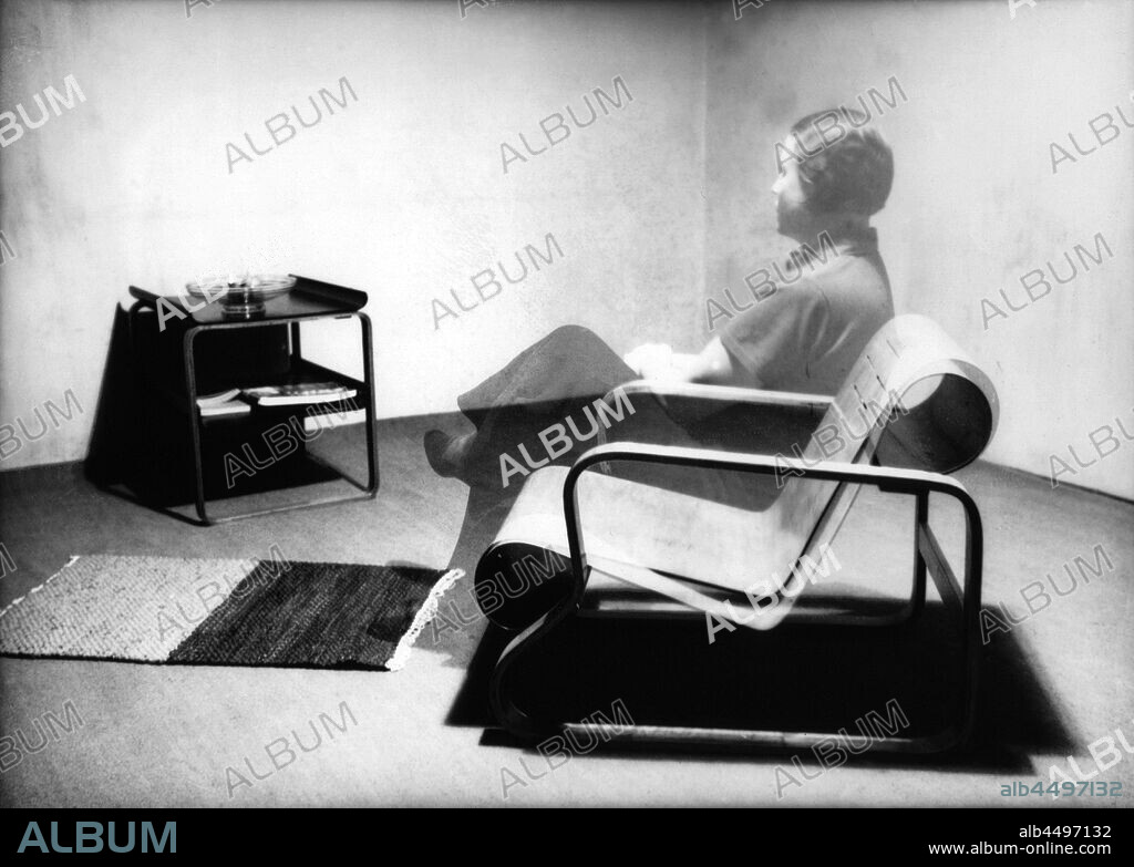 ALVAR AALTO. Aino Aalto Sitting on a Paimio Chair.