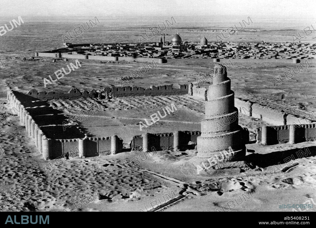Abu Dulaf Mosque is a historic mosque located north of Samarra in the Saladin Governorate, Iraq. The mosque was commissioned by the 10th Abbasid Caliph Al-Mutawakkil in 859. The mosque is rectangular shaped, and consisted of the open air sahn surrounded by the corridors with the qibla corridor being the biggest of them. The mosque is among the largest mosques in the world measured by area size, reaching 504,000 square feet wide. The iconic spiral minaret which resembles the renowned Malwiya of the Great Mosque of Samarra is located at the northern side. The unique design of the minaret is said to be inspired by the similar structure in Firuzabad. The minaret reaches 105 feet and standing on a square base Abbasid architecture developed in the Abbasid Caliphate between 750 and 945, primarily in its heartland of Mesopotamia. The Abbasids inherited Persian architectural traditions in Mesopotamia, and were later influenced by Central Asian styles. They evolved distinctive styles of their own, particularly in decoration of their buildings. While the Abbasids lost control of large parts of their empire after 850, their architecture continued to be copied by successor states in Iran, Egypt and North Africa. No photographer credited, undated.