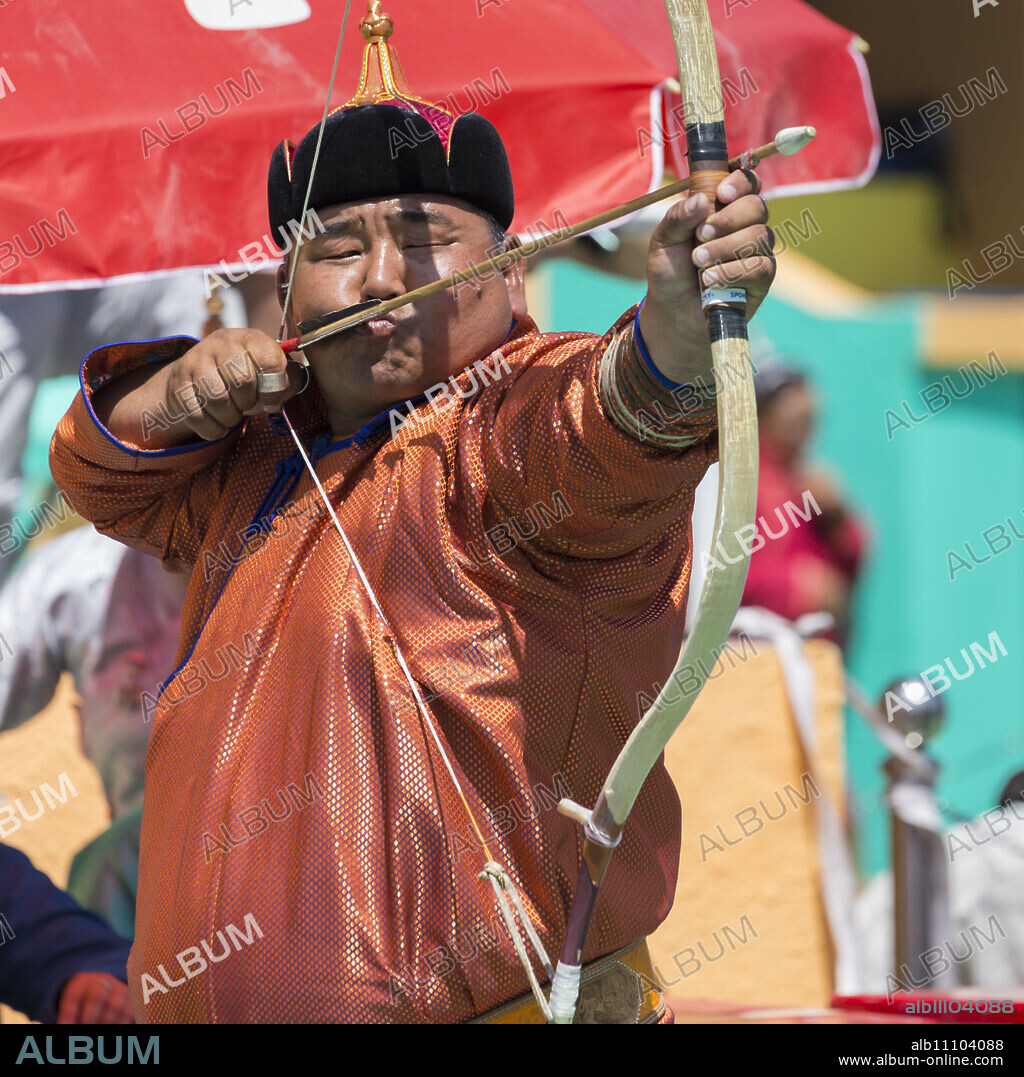 Male archer takes aim, National Archery Tournament, Archery Field, Naadam Festival, Ulaan Baatar (Ulan Bator), Mongolia, Central Asia, Asia.