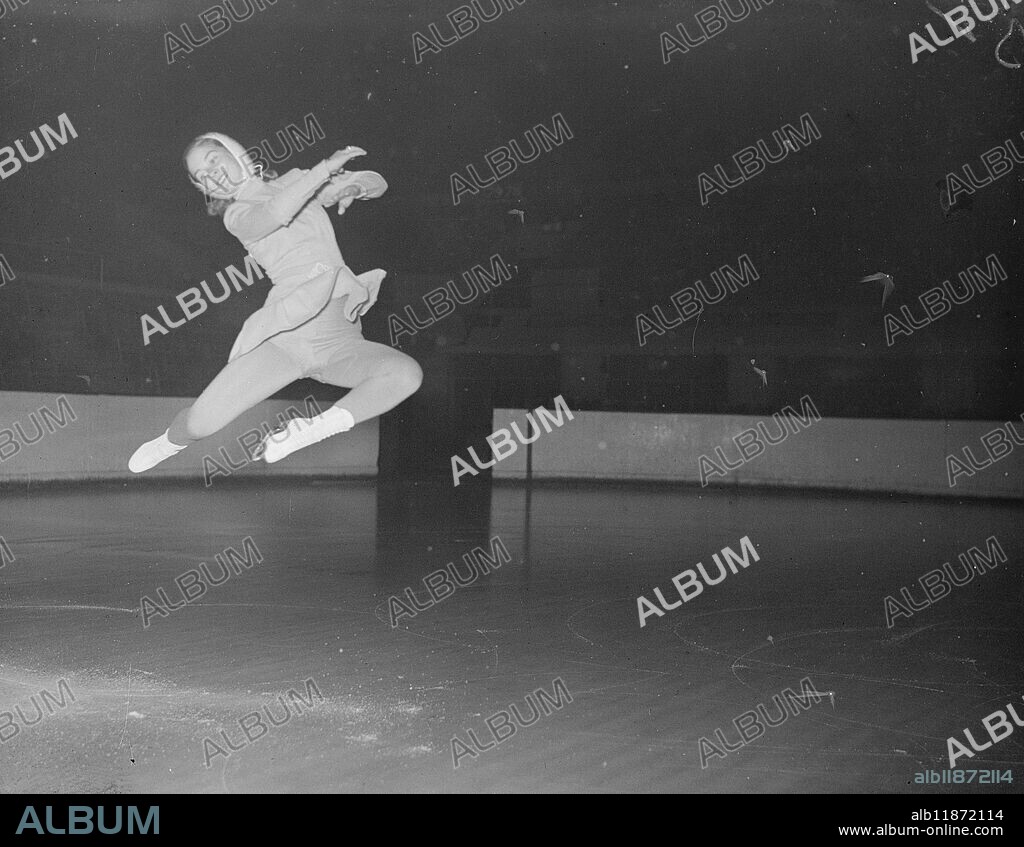 Olympic Wings At Wembley. "Stopped" by the high-speed camera is Olympic and world figure skating champion Barbara Ann Scott of Canada, as she gives an exhibition at the Empire pool, Wembley, this evening, (Wednesday). 3rd March 1948.