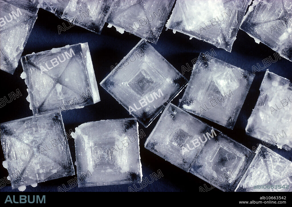 Sodium chloride crystals. Better known as salt, this ionic compound (NaCl) consists of ions of sodium (Na) and chlorine (Cl). As it is an ionic compound, it can dissolve in polar solvents (such as water) to form a solution. The solid crystals can be reformed by evaporation. It is obtained from sea water and underground deposits. It is an essential part of the diet, sodium and chloride ions being vital for body biochemistry, reflecting life's origin in the sea. NaCl is an industrial source of sodium and chlorine.