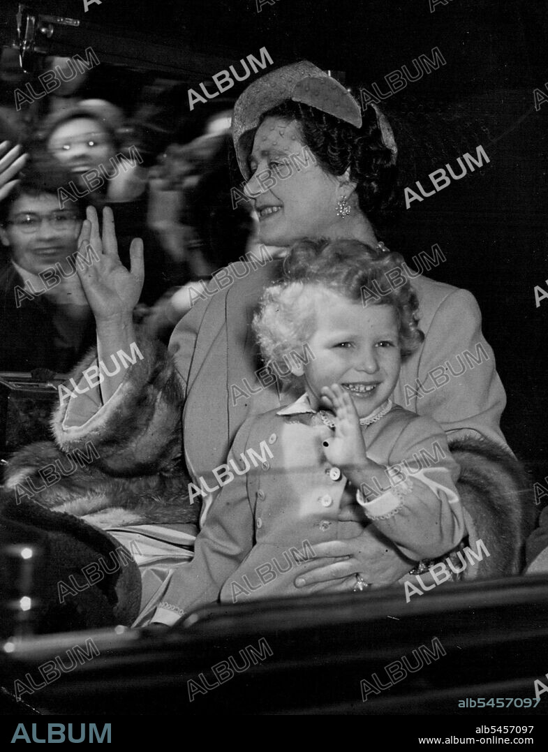 The Regal, And The Grandmotherly, Touch - Princess Anne, the Queen Mother's kindly and protective arm encircling her waist to keep excitement within bounds, smiles and happily waves to the crowds as she leaves Clarence House, London, today (Wednesday) at the start of her long journey, with her brother, the Duke of Cornwall, to meet their parents at Tobruk. The two children will be embarking at Portsmouth on the Royal yacht Britannia for North Africa, where they will meet the Queen and the Duke of Edinburgh returning from the Commonwealth tour. April 14, 1954. (Photo by Reuterphoto).