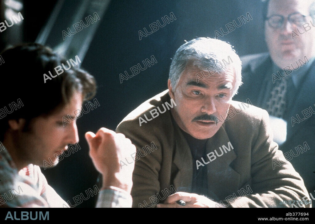 BURT REYNOLDS and PETER FACINELLI in TEMPTED, 2001, directed by BILL BENNETT. Copyright GOFD CIRCLEE FILMS/CHEATER LLC/B.J. FILMS/TF 1 INTERNATIONAL.