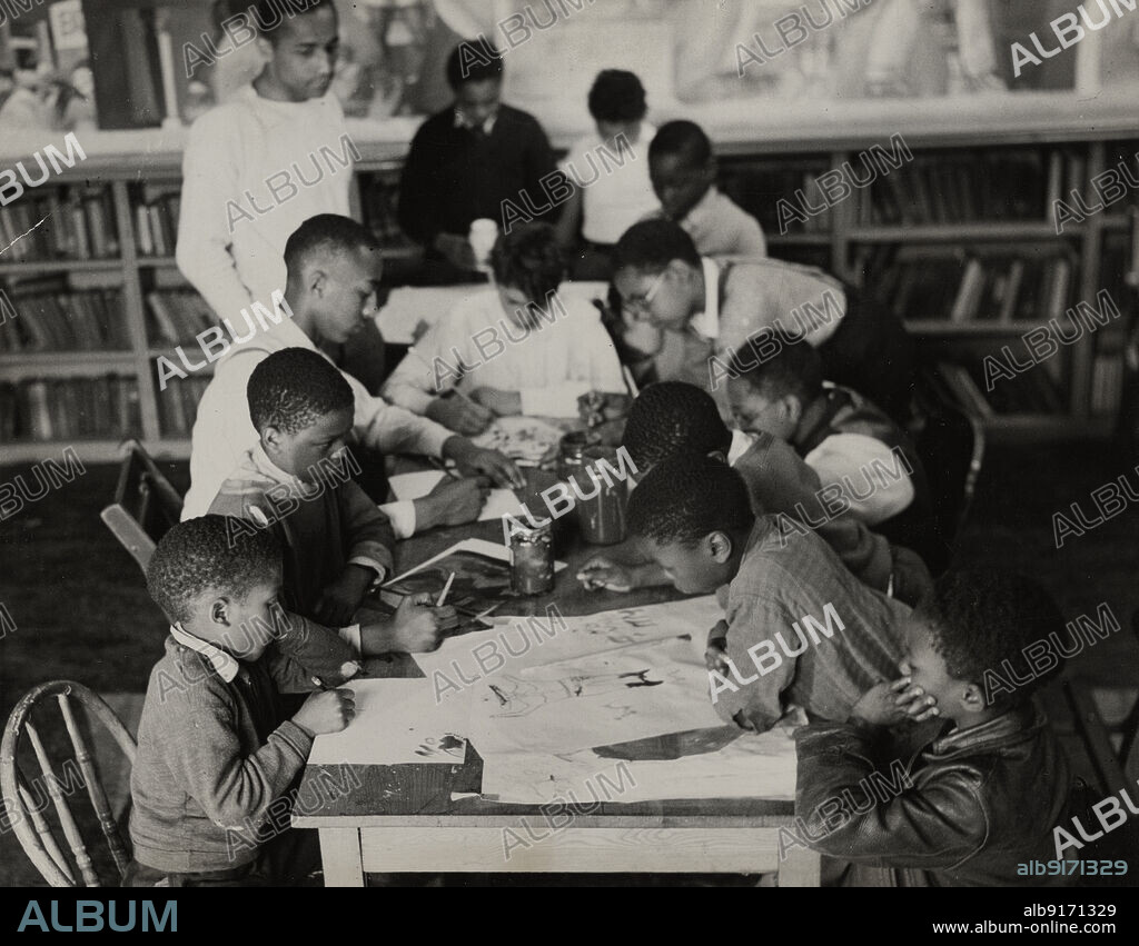 ANDREW HERMAN. Oliver Harrington supervises class studying mural work, Hudson Ave Boys' Club, 1936.