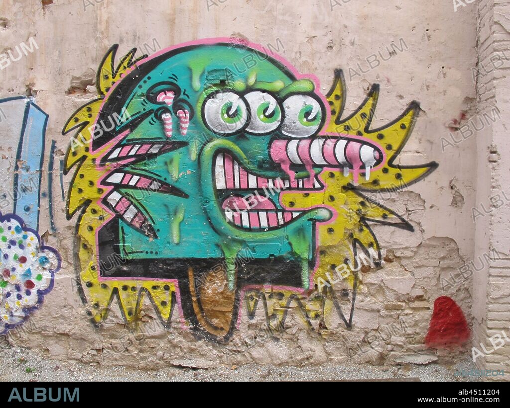 Ilustración estilo cómic de monstruo con tres ojos, graffiti mural, barrio Raval, Distrito V, Barcelona en 2016.