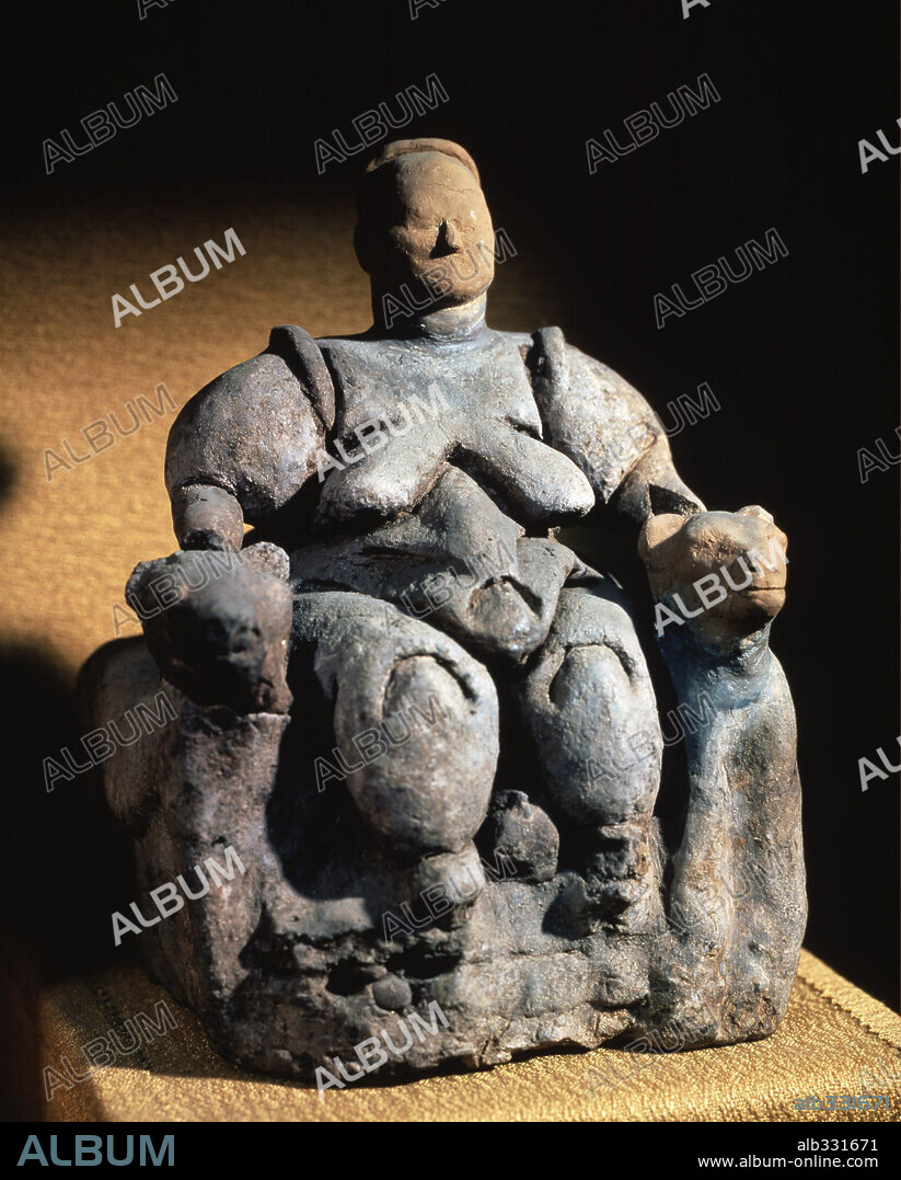 Mother Goddess giving birth between Lions or Leopards from Catal-Huyuk c.6000-5800 b.C terracotta sculpture.