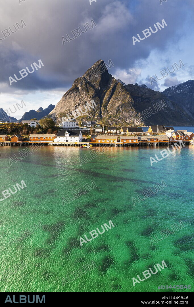 Town of Sakrisoy under Olstinden mountain in Reine, Norway, Europe.