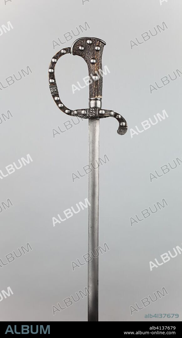 Boar Sword. German. Date: 1650-1660. Dimensions: Overall L. 97 cm (38 1/2 in.)
Blade L. 82 cm (32 1/4 in.)
Wt. 2 lb. 8 oz. Steel, staghorn, and iron. Origin: Germany.