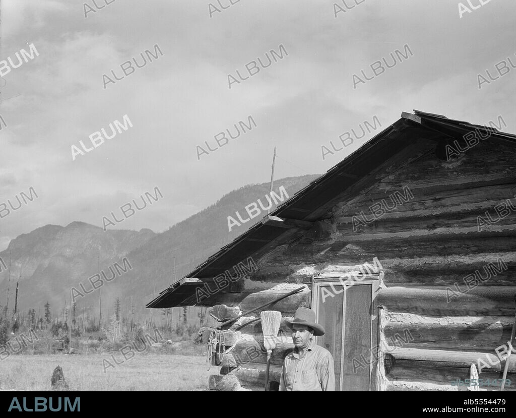 DOROTHEA LANGE. The mother, father, and hardworking fifteen-year-old son in yard before the barn. Boundary County, Idaho.