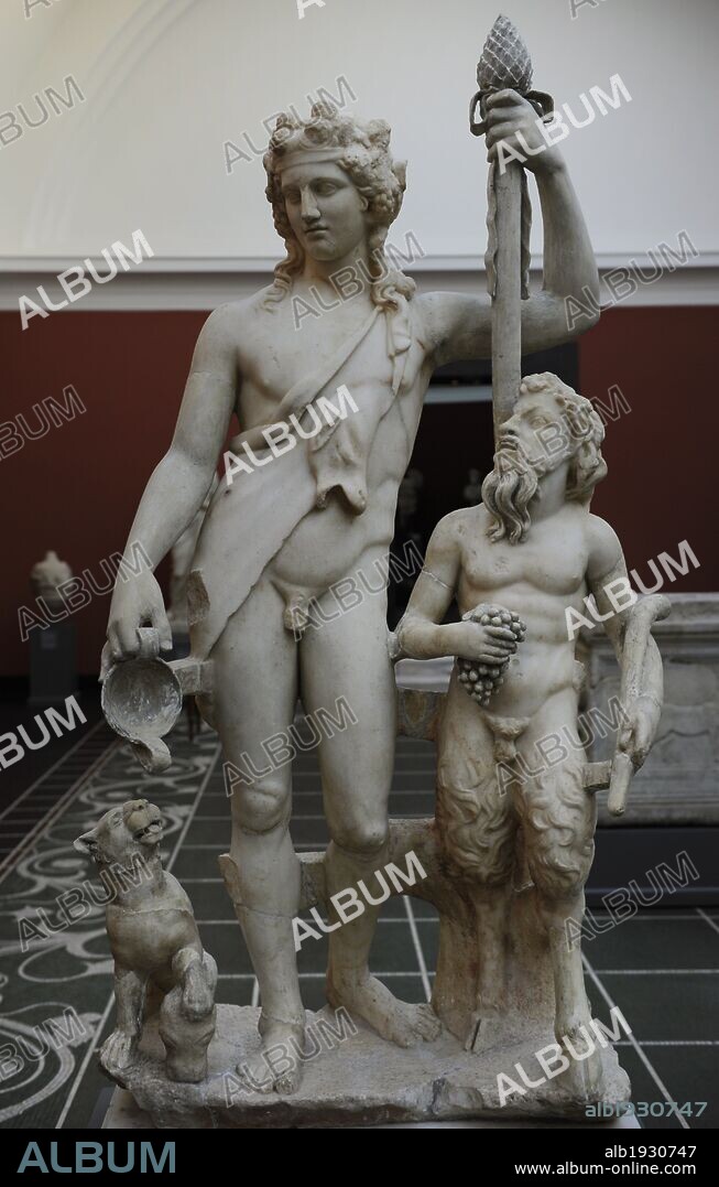 Bacchus (Roman) also known as Dionysus (Greek). God of the grape harvest in classical mythology. Statue of Bacchus with satyr and panther. From roman Villa of Pozzuoli, near Naples, Italy. 2nd century AD. Marble. Ny Carlsberg Glyptotek. Copenhagen, Denmark.