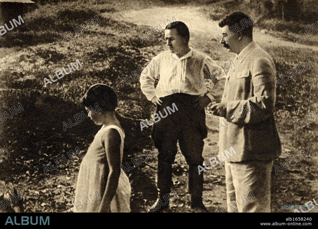 Joseph Stalin 1878-1953), right, Sergei Kirov (1886-1934) and Svetlana Stalina also called Svetlana Alliluyeva or Lana Peters (b1926) Stalin's daughter, in the Russian countryside, 1934.