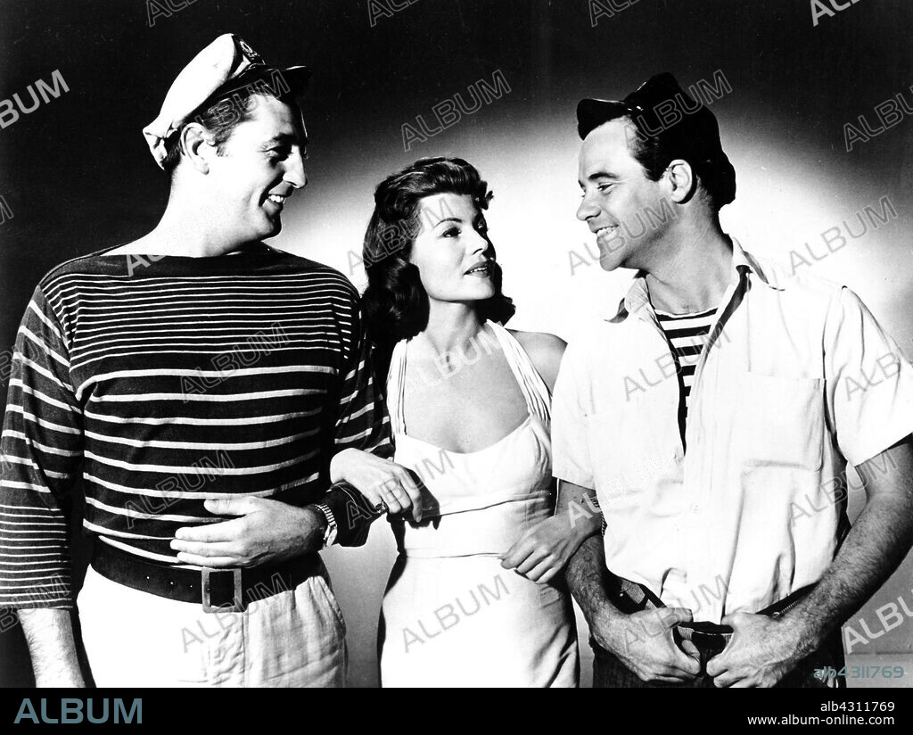 JACK LEMMON, RITA HAYWORTH and ROBERT MITCHUM in FIRE DOWN BELOW, 1957, directed by ROBERT PARRISH. Copyright COLUMBIA PICTURES.