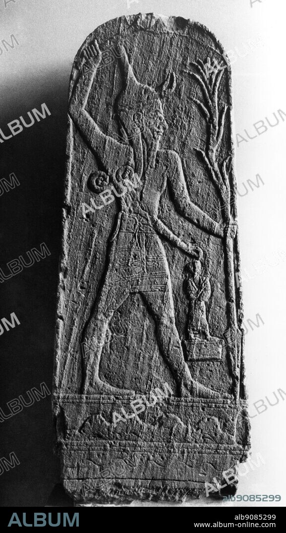 Baal, a relief from Ugarit (Ras Shamra) 18-19th century BC. Ba`al (often spelled Baal) is a Northwest Semitic title and honorific meaning "master" or "lord" that is used for various gods who were patrons of cities in the Babylon, cognate to Assyrian Belu. ©TopFoto.