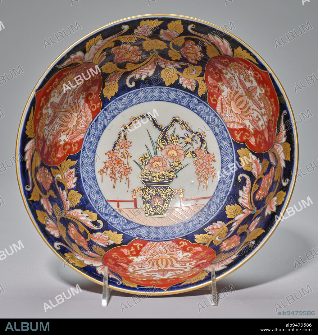 Bowl, late 17th century, Unknown Japanese, H.4 x Dia.10 in., Imari ware; porcelain with underglaze blue and overglaze enamels and gold, Japan, 17th century, The bold division of this bowl into symmetrical, but fancifully, delineated compartments around a central roundel is indicative of the fully developed Imari style of the late 17th century. Such wares were brought to Europe in great numbers by the Dutch East India Company where they were in high demand among British and Dutch collectors.