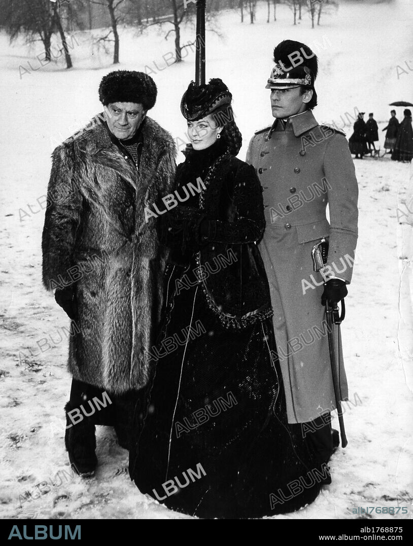 Luchino Visconti, Helmut Berger and Romy Schneider on the set. Italian director Luchino Visconti and Austrian actors Romy Schneider and Helmut Berger on the set of 'Ludwig'. Bad Ischl, 1973.