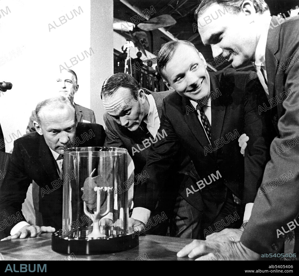 Apollo 11 astronauts, (left to right) Buzz Aldrin, Lunar Module pilot; Michael Collins, Command Module pilot; and Neil Armstrong, commander, are showing a two-pound Moon rock to Frank Taylor, director of the Smithsonian Institute in Washington D.C. The rock was picked up from the Moon’s surface during the Extra Vehicular Activity (EVA) of Aldrin and Armstrong following man’s first Moon landing and was was presented to the Institute for display in the Art and Industries Building. Apollo 11 was the spaceflight that landed the first two people on the Moon. Commander Neil Armstrong and lunar module pilot Buzz Aldrin landed the Apollo Lunar Module Eagle on July 20, 1969. Armstrong became the first person to step onto the lunar surface six hours later on July 21; Aldrin joined him 19 minutes later. They spent about two hours together outside the spacecraft, and collected 47.5 pounds of lunar material to bring back to Earth. Command module pilot Michael Collins flew the command module Columbia alone in lunar orbit while they were on the Moon's surface. Armstrong and Aldrin spent 21.5 hours on the lunar surface before rejoining Columbia in lunar orbit. September 15, 1969.