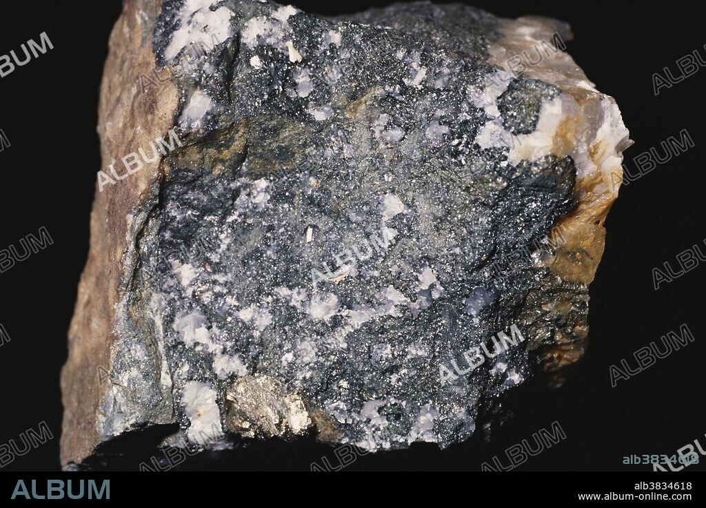 The chlorite group is a series of micaceous aluminum silicate minerals with varying amounts of iron, magnesium, nickel,  manganese and other metals.  Chlorite minerals are found in both igneous and metamorphic rocks.
