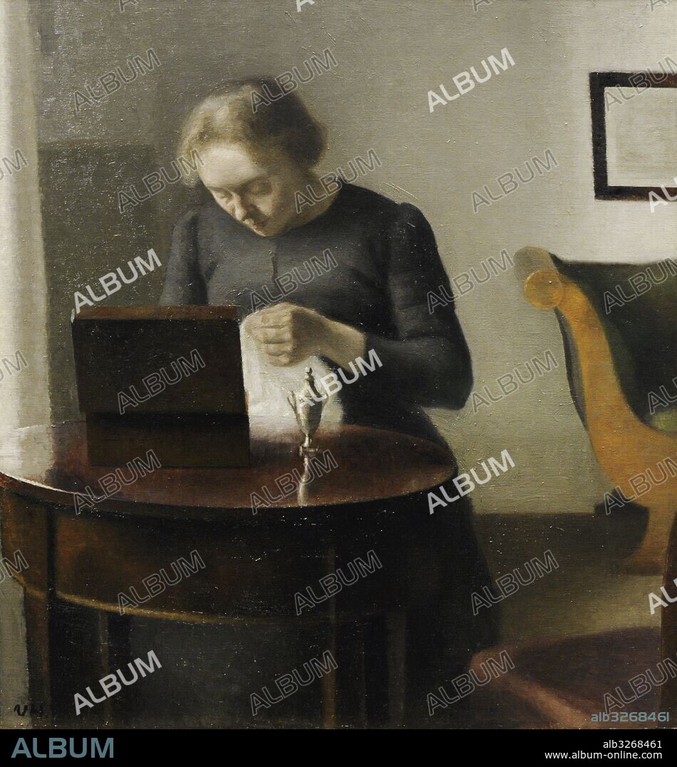 Vilhelm Hammershoi (1864-1916). Pintor danés. La esposa del artista en la mesa de costura, hacia 1897. Galeria Nacional. Museo Nacional de Arte, Arquitectura y Diseño. Oslo. Noruega.
