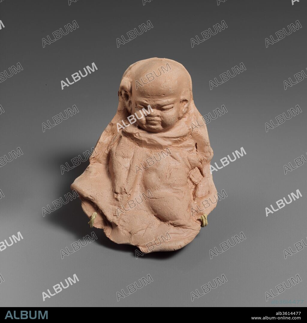 Terracotta mold of a grotesque figure. Culture: Greek. Dimensions: 3 1/8 x 3 1/2 in.  (7.9 x 8.9 cm). Date: 2nd-1st century B.C..
The modern impression displayed with the mold illustrates the form made from the ancient mold.