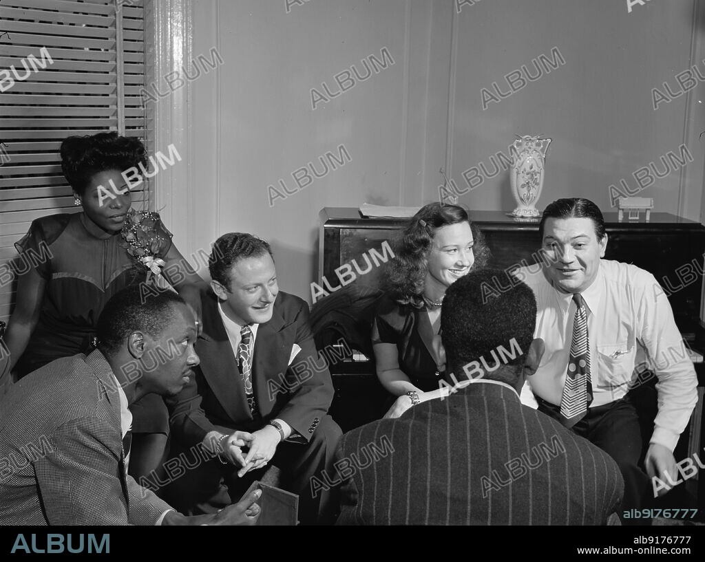 WILLIAM PAUL GOTTLIEB. Portrait of Tadd Dameron, Mary Lou Williams, Milt Orent, Dixie Bailey, Jack Teagarden, and Dizzy Gillespie, Mary Lou Williams' apartment, New York, N.Y., ca. Aug. 1947.