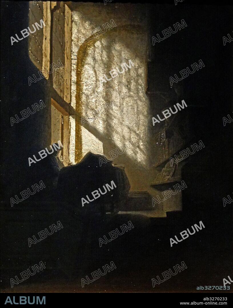 Painting titled 'A Man seated reading at a Table in a Lofty Room' by a Follower of Rembrandt. Dated 17th Century.