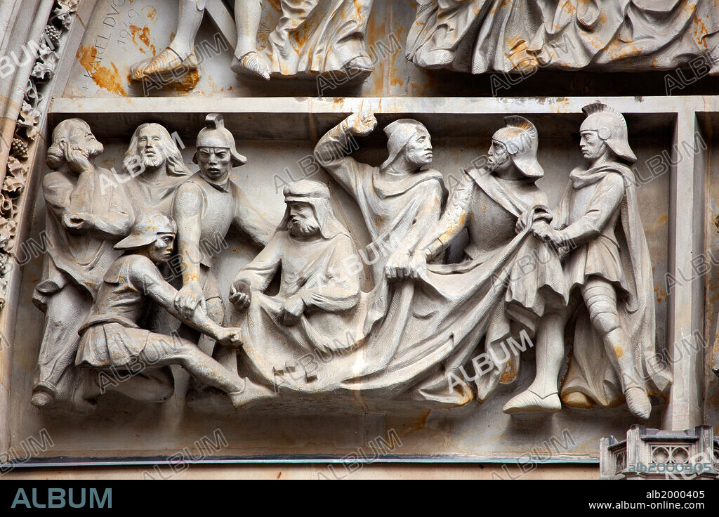 KARL DVORAK. Prague, St. Vitus Cathedral, Central Portal, Western Facade, Tympanum Reliefs Above Bronze Door. Tympanum Reliefs Above the Bronze Door of the central portal in the St. Vitus Cathedral's western facade, depicting a game of dice for in order to win Christ's garments after his crucifixion. This work was carved circa 1949.