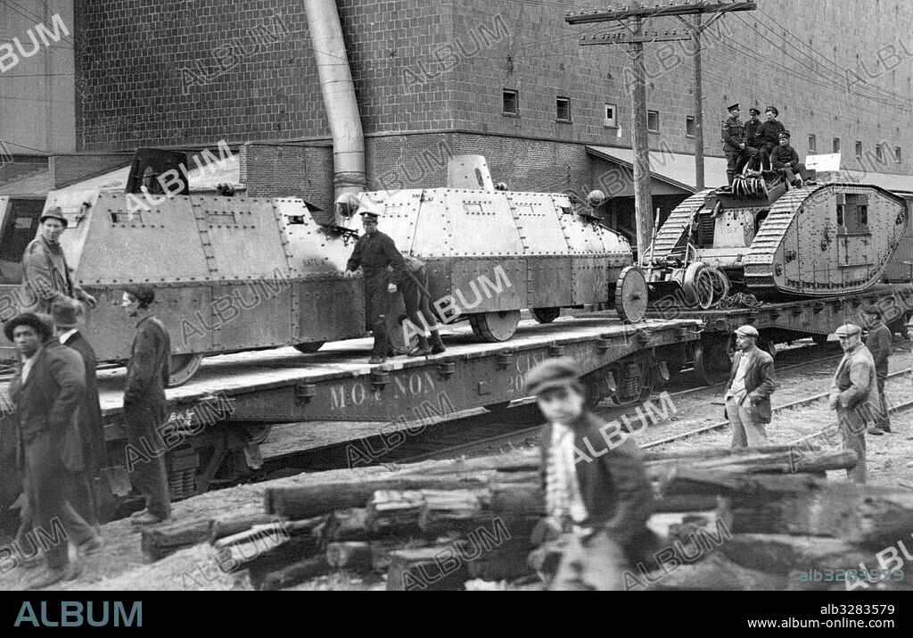 Location Unknown:  c. 1917 Armored cars and tanks on railroad cars.