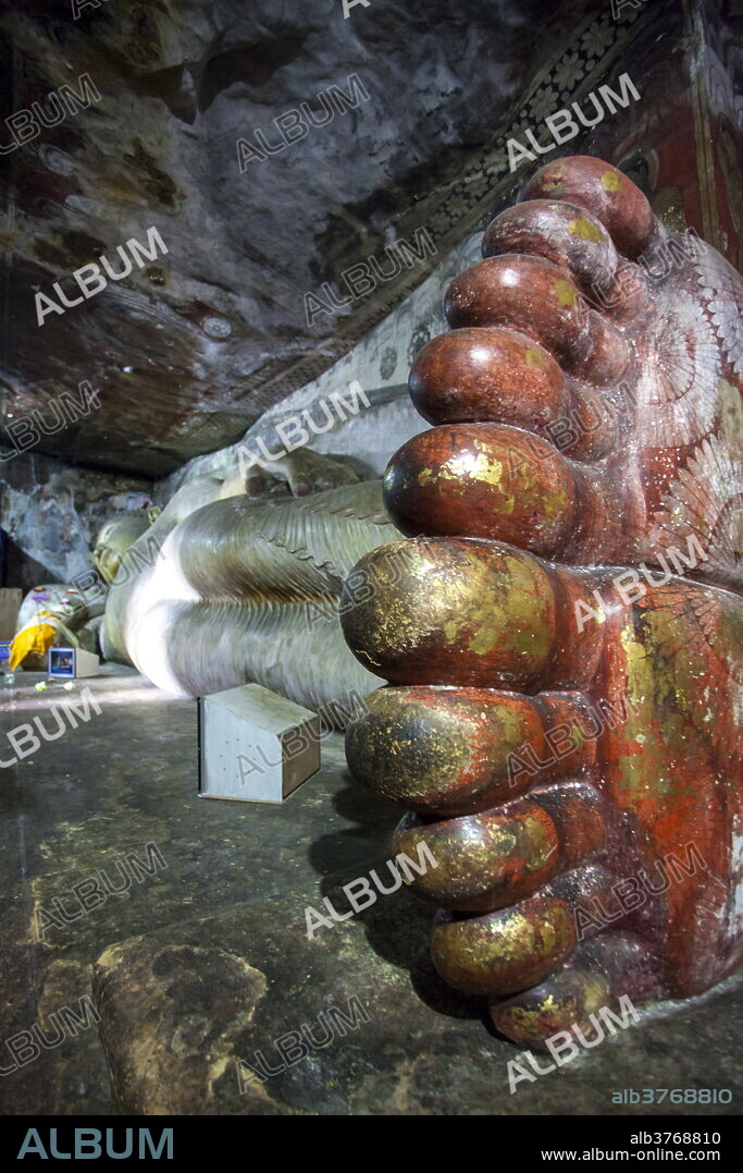 Statue of reclining Buddha, Royal Rock Temple, Golden Temple of Dambulla, UNESCO World Heritage Site, Dambulla, Sri Lanka, Asia.