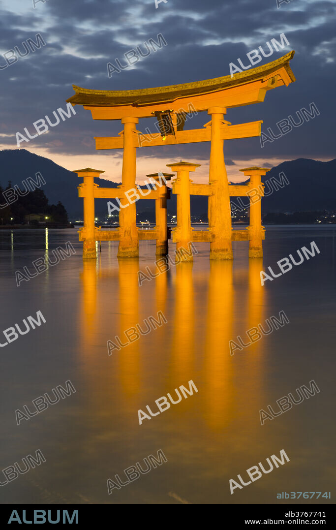 The floating Miyajima torii gate of Itsukushima Shrine at dusk, UNESCO World Heritage Site, Miyajima Island, Western Honshu, Japan, Asia.